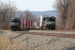 NS 1135 leads train 294 east past a stack train on the siding